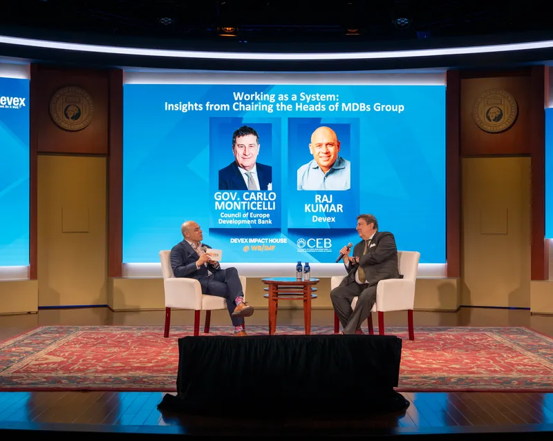 Governor Carlo Monticelli and Raj Kumar at the Devex Impact House during the 2025 Annual Meetings, Wednesday 15th October 2025, Washington DC